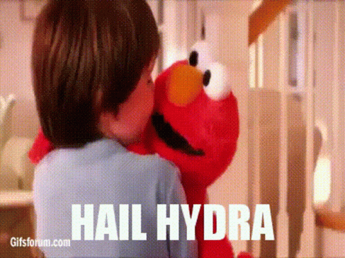 Child Hugging Elmo from Sesame Street