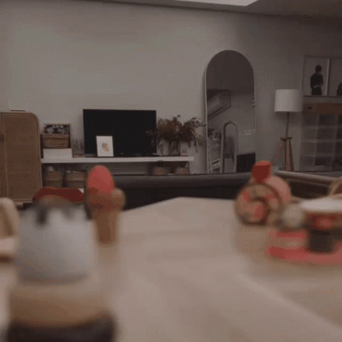 Child Sitting At Table With Toys GIF