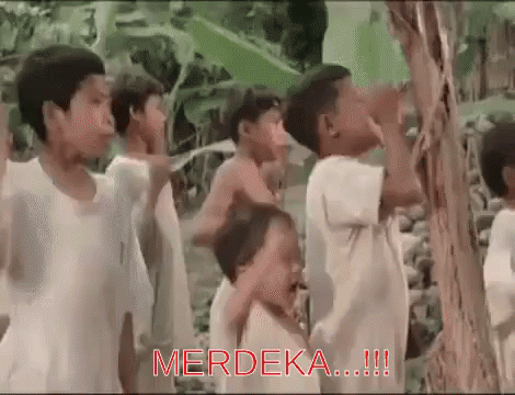Children Around Tree With Merdeka In Red GIF