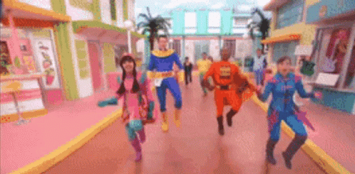 Children in Superhero Costumes Running