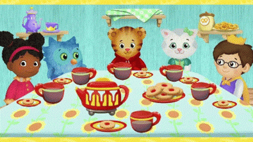 Children Sitting Around Table With Tea Cups and Cookies