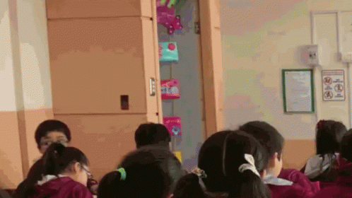 Children Sitting In Classroom With No Smoking Sign GIF