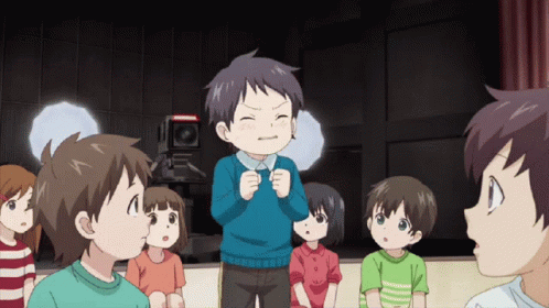 Children Standing Around Boy In Blue Shirt GIF