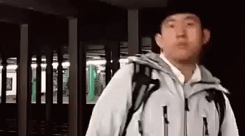 Chinese Man Wearing Jacket Says Okay GIF