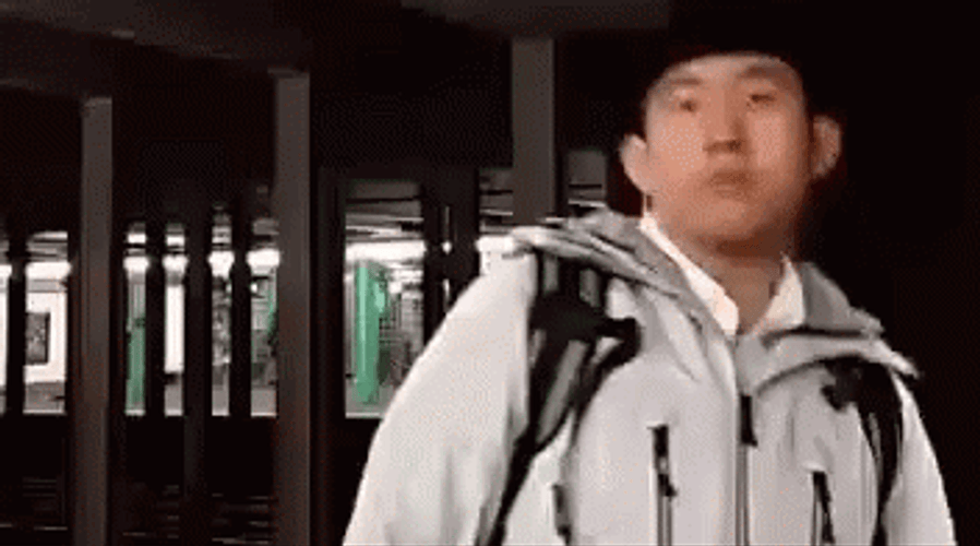 Chinese Man Wearing Jacket Says Okay GIF