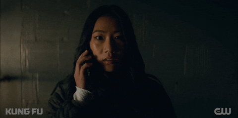 Chinese Woman Ending Phone Call GIF