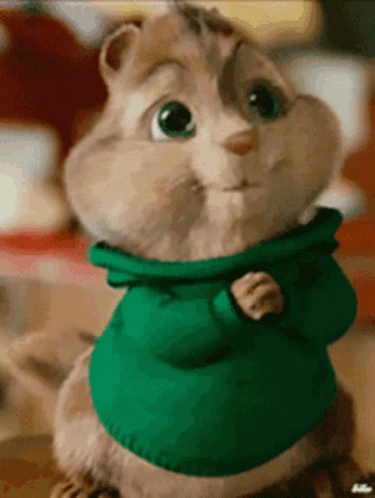 Chipmunk In Green Sweater Looking At Camera GIF
