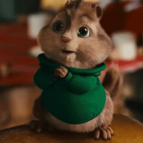 Chipmunk In Green Sweater Standing On Table GIF