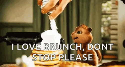 Chipmunk Sitting Next to Pancakes with Whipped Cream