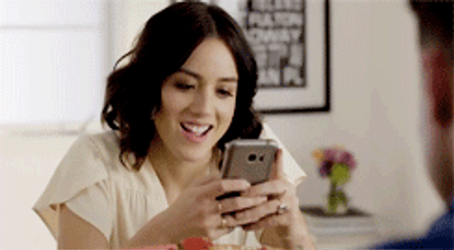 Chloe Bennet Texting On Her Phone GIF