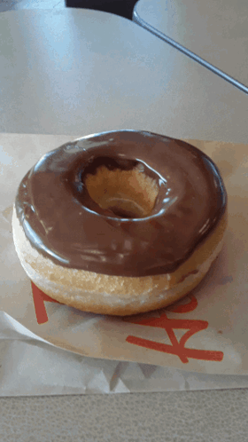 Chocolate Covered Donut On Paper Saying AA GIF