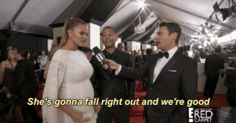 Chrissy Teigen Flexing Pregnant Belly At Red Carpet GIF