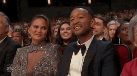 Chrissy Teigen Snickering GIF