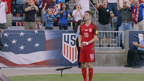 Christian Pulisic Arms Stretched Walking Away GIF