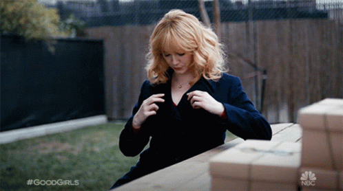 Christina Hendricks Fixing Herself And Do Sexy Postures GIF