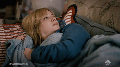 Christina Hendricks Lying In A Sofa GIF