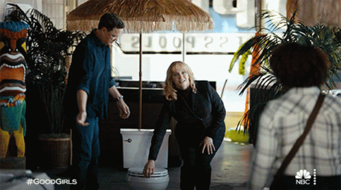 Christina Hendricks With A Toilet Bowl Full Of Cash GIF