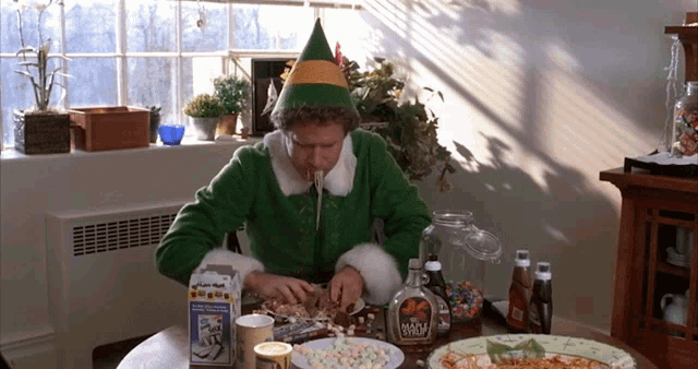 Christmas Elf Eating Pasta GIF