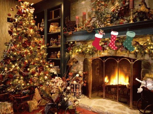 Christmas Stockings Hanging On A Mantle With A Fireplace In The Background GIF