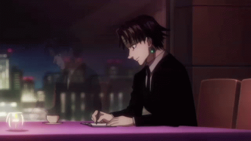 Chrollo On A Table Writing GIF