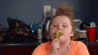 Chubby Girl Licks Peanut Butter On Spoon GIF