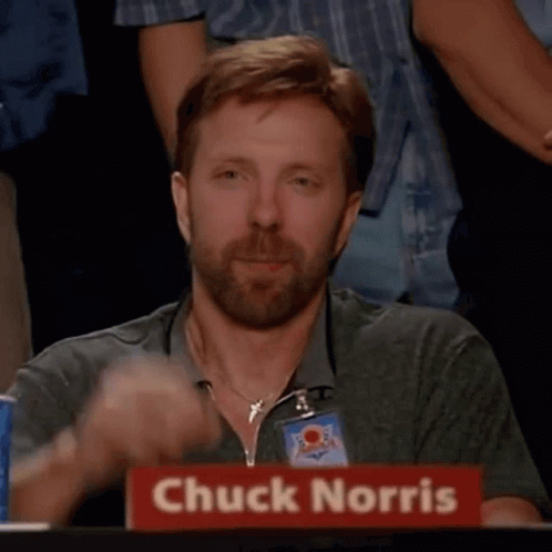Chuck Norris Is Giving A Thumbs Up In Front Of A Crowd GIF