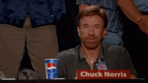 Chuck Norris Is Giving A Thumbs Up In Front Of A Pepsi Cup GIF