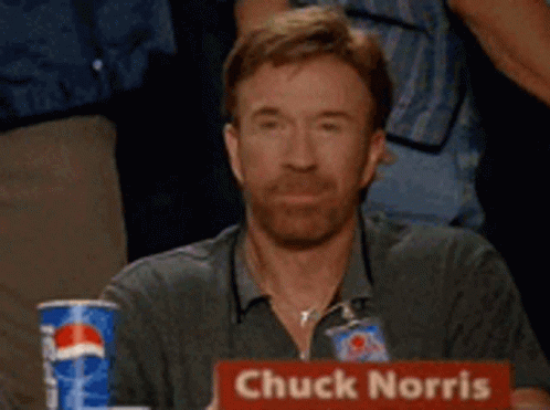 Chuck Norris Is Sitting At A Table With A Pepsi Can GIF