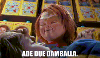 Chucky Doll Holding Child Saying Ade Due Damballa
