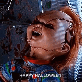 Chucky From Childs Play Is Holding A Pair Of Scissors In His Hand And Says `` Happy Halloween '' . GIF