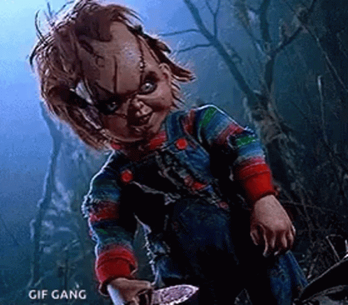 Chucky Holding Knife in Dark Forest