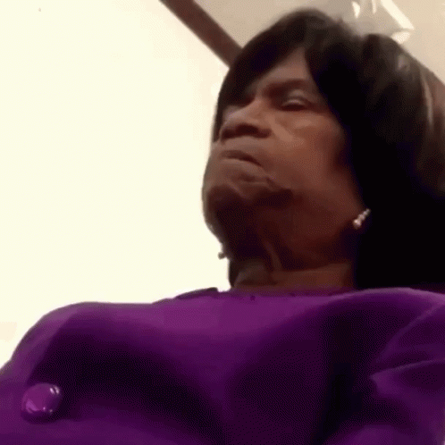 Church Lady On Purple Clothes Shaking Head GIF