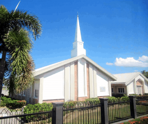 Church With Steeple And Sign Saying Jesus GIF
