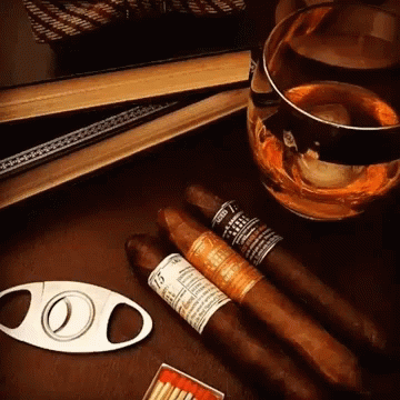 Cigar Cutter Next to Cigars