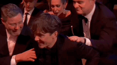 Cillian Murphy Stands And Hug A Friend GIF