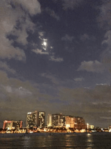 City Skyline With Full Moon GIF