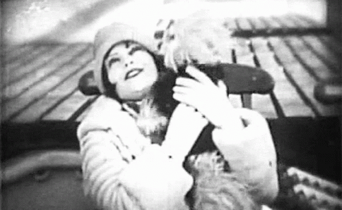 Clara Bow Hugging A Dog GIF