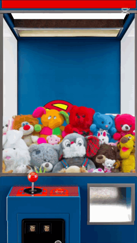 Claw Machine With Stuffed Animals and Superman Pillow