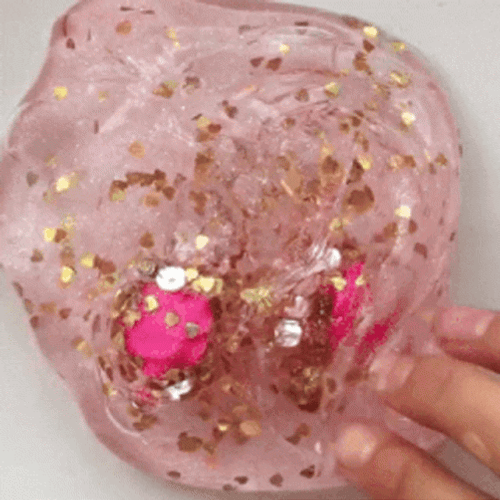 Clear Pink Slime With Charms GIF