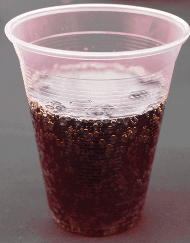 Clear Plastic Cup with Dark Liquid