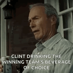 clint eastwood is drinking the winning team 's beverage of choice while sitting on a porch .
