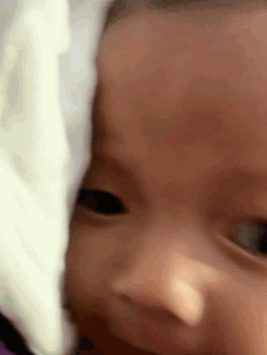 Close Up Baby Face with White Blanket