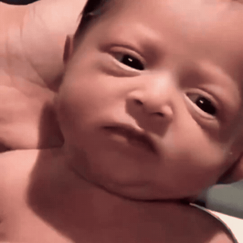 Close Up Baby Serious Face GIF