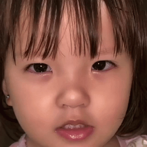 Close Up Baby With Tear Running Down Eye GIF