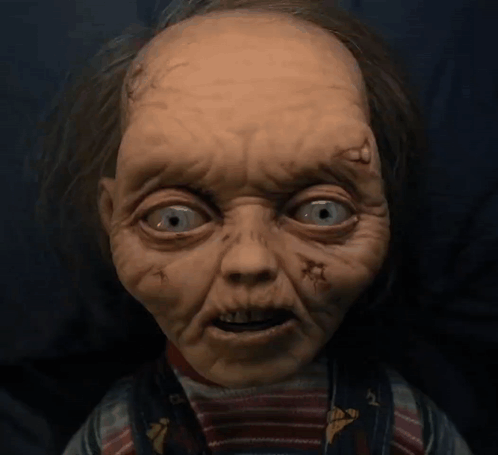 Close Up Doll Face with Holes in Eyes