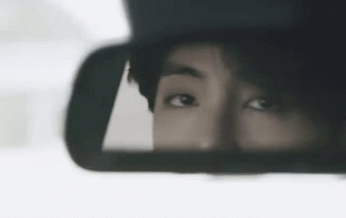 Close Up Eyes in Rear View Mirror