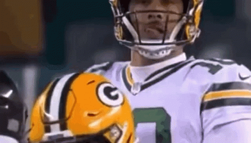 Close Up Football Player Holding Helmet GIF