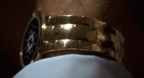 Close Up Gold Watch on Man's Arm