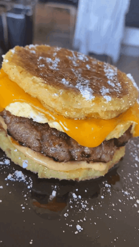 Close Up Hamburger With Cheese and Eggs on Pancake