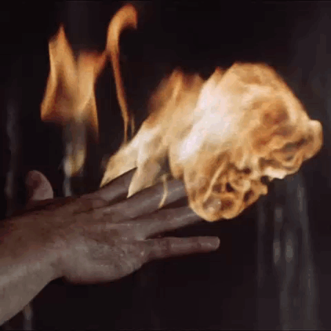 Close Up Hand Holding Torch In Dark Room GIF